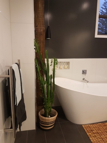 Focal of the upstairs bath and new heated towel rail within reach of the shower and the bath at Dudley Ave